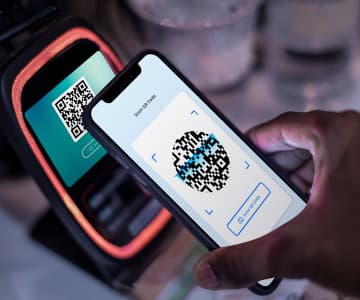 Phone scans code for payment