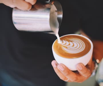 Barista creates a coffee masterpiece