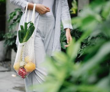 Girl carrying fresh fruit